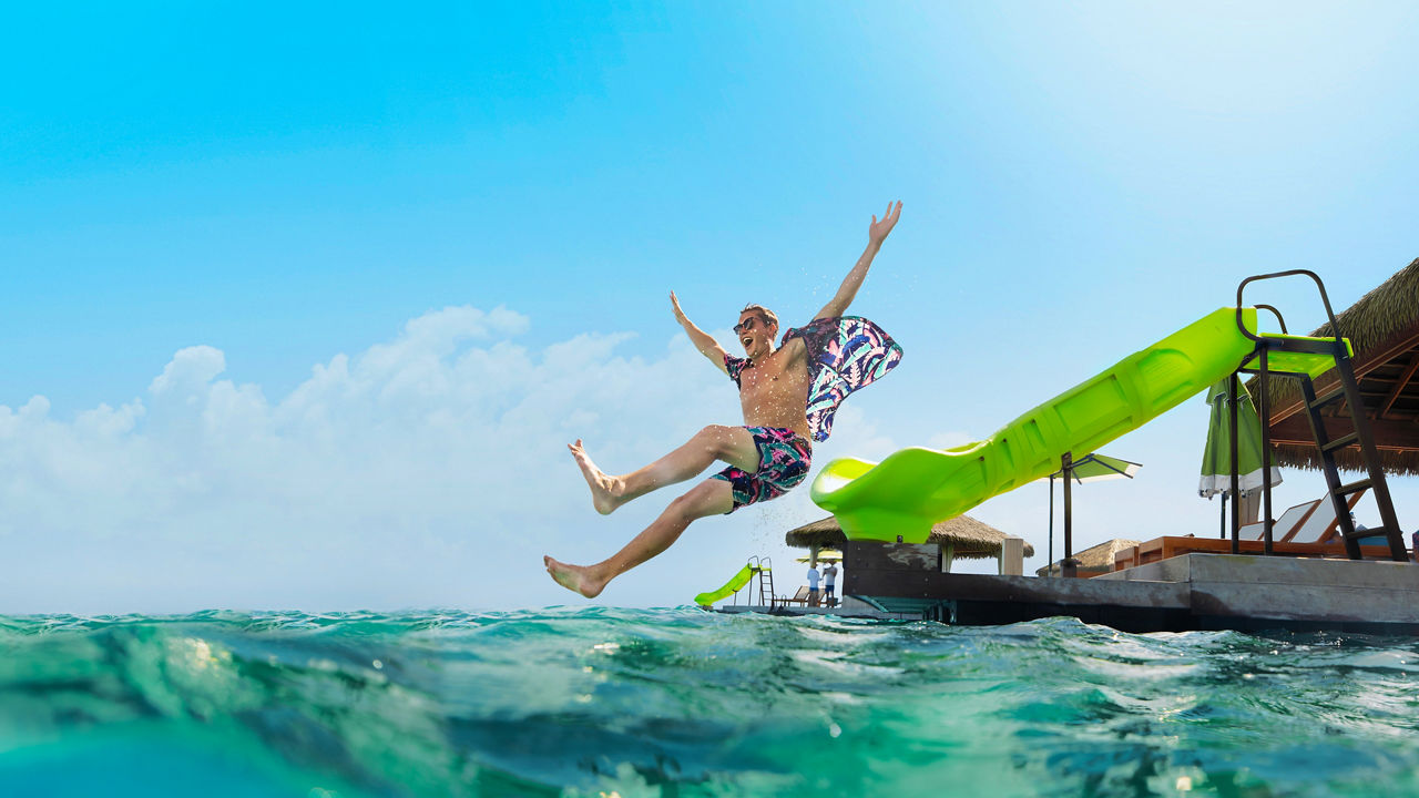 Man Jumping from Slide at CocoCay Cabana HP Jumbotron 1920 1080 FAM NF 2x