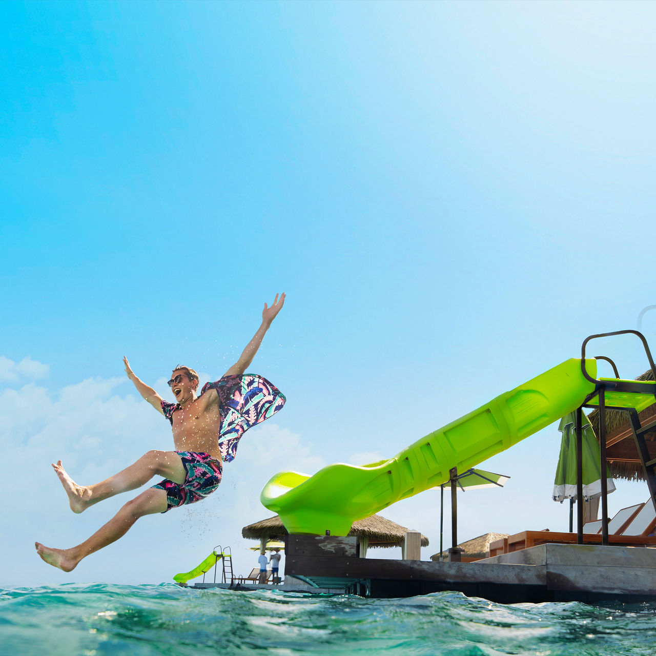 Man Jumping from Slide at CocoCay Cabana Square 1050 1050 FAM NF 2x