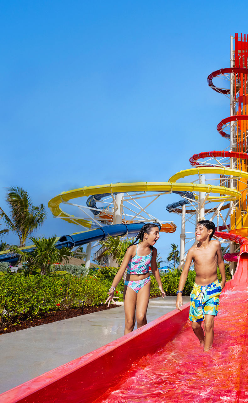 Girl and boy at Thrill Waterpark Cococay Vrt Banner 880 1428 FAM NF 2x