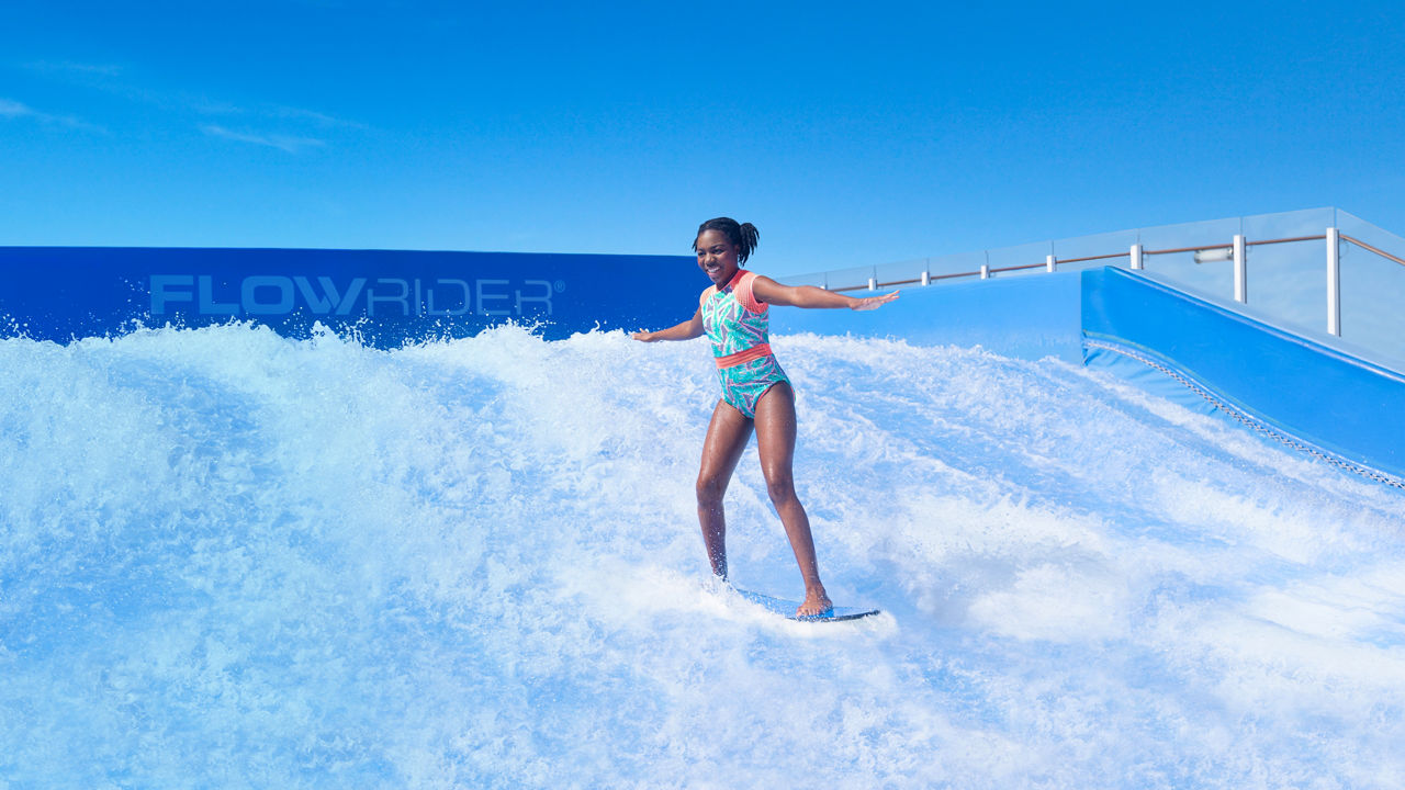 girl surfing in flowrider hp jumbotron 1920 1080