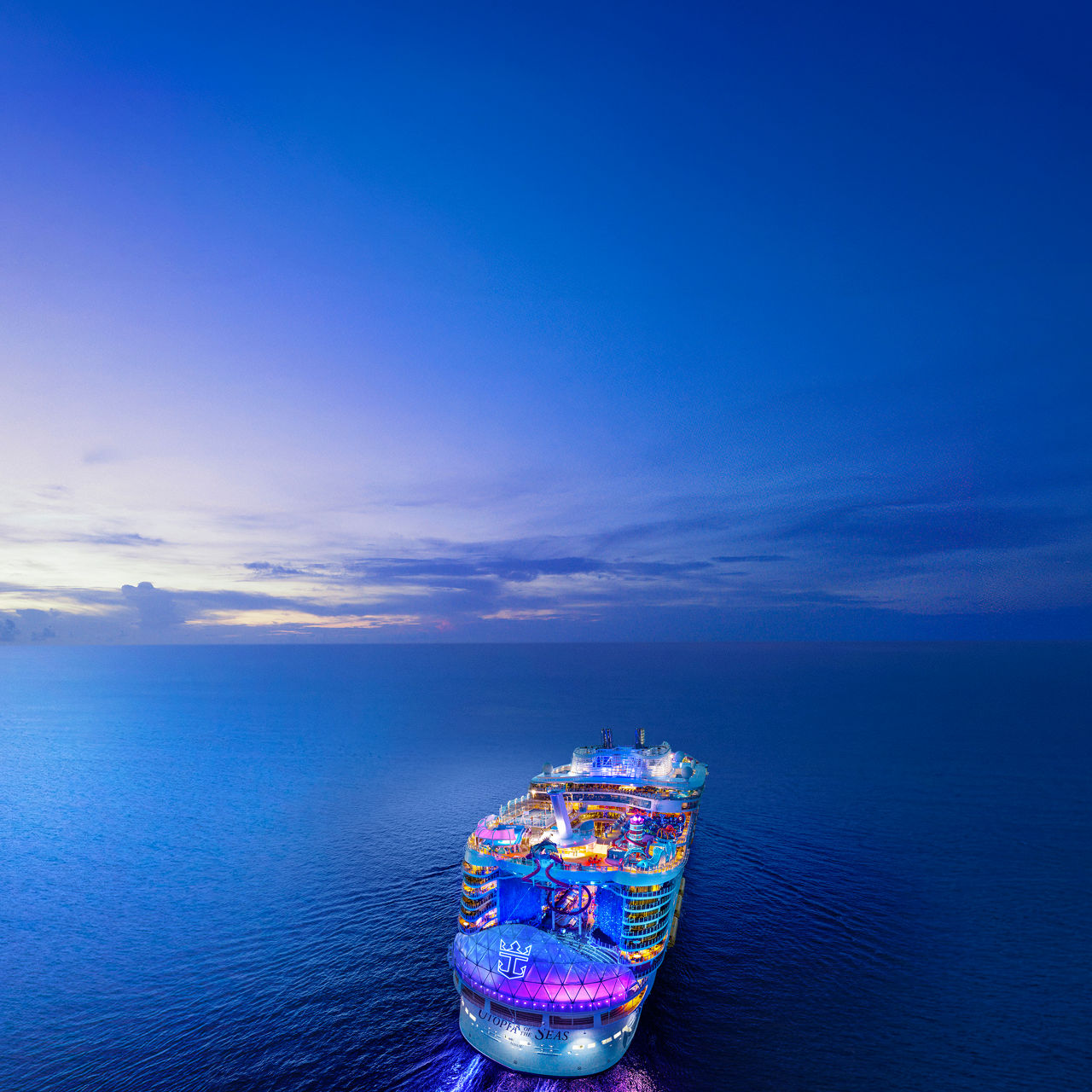 november caribbean cruise deals back aerial view utopia of the seas at night square 1050 1050