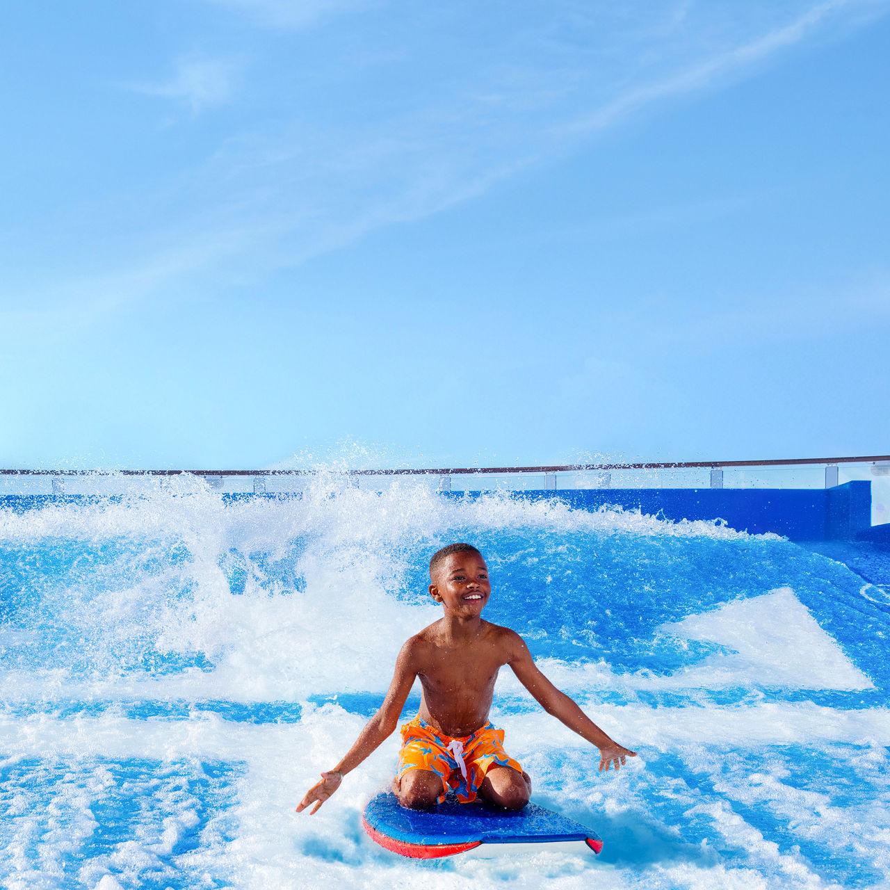 april caribbean cruises deals boy having fun surfing at flowrider square 1050 1050