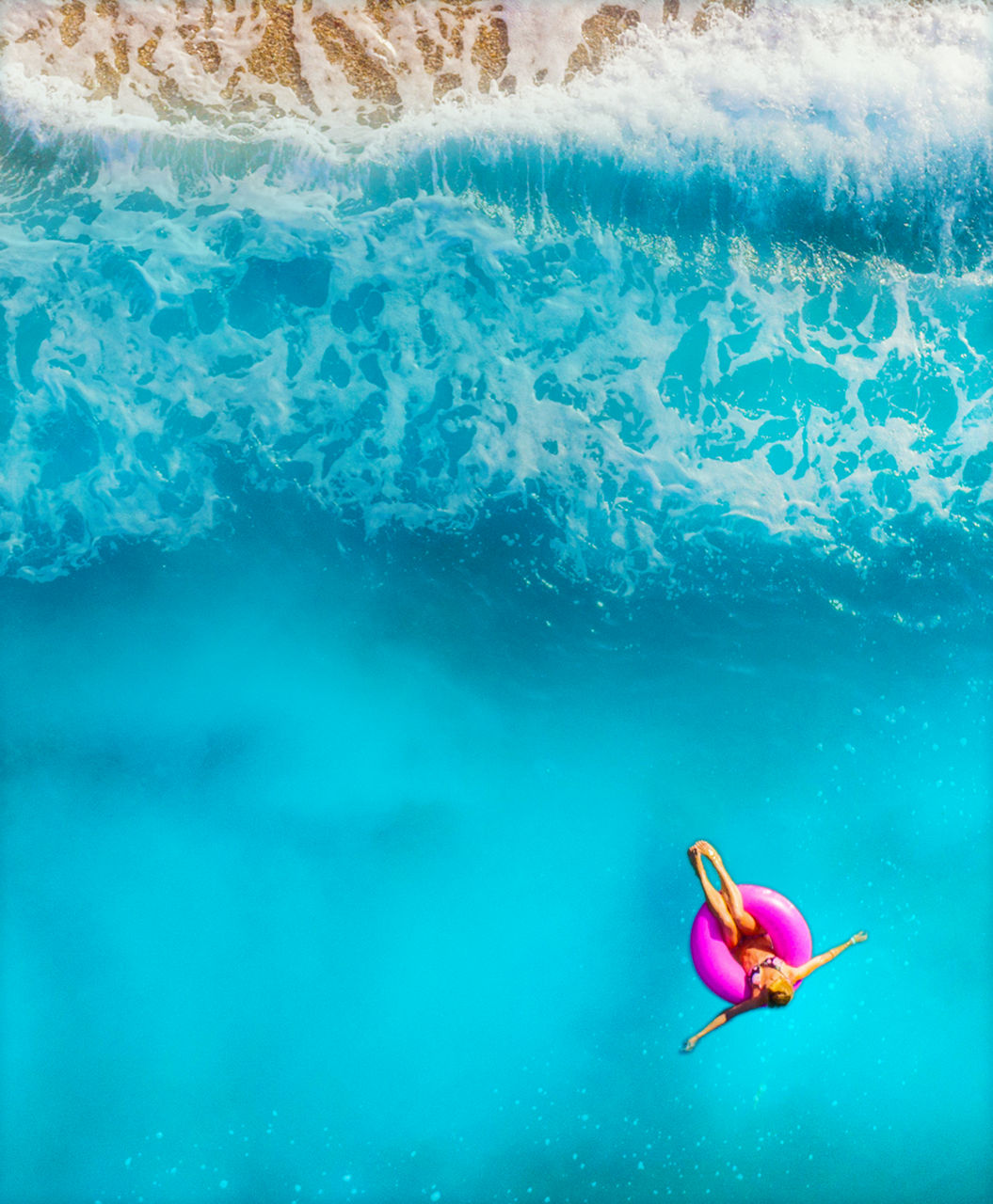 Girl floating at the beach in Charlotte Amalie, St. Thomas | Mobile HP
