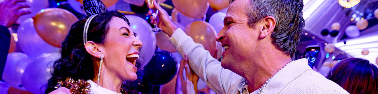 Couple celebrating New Year's Eve Balloon drop