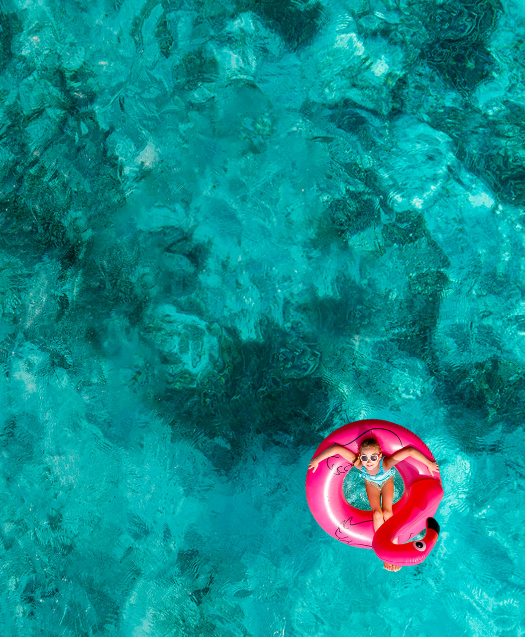 Aerial view kid floating Kings Wharf, Bermuda | HP Mobile