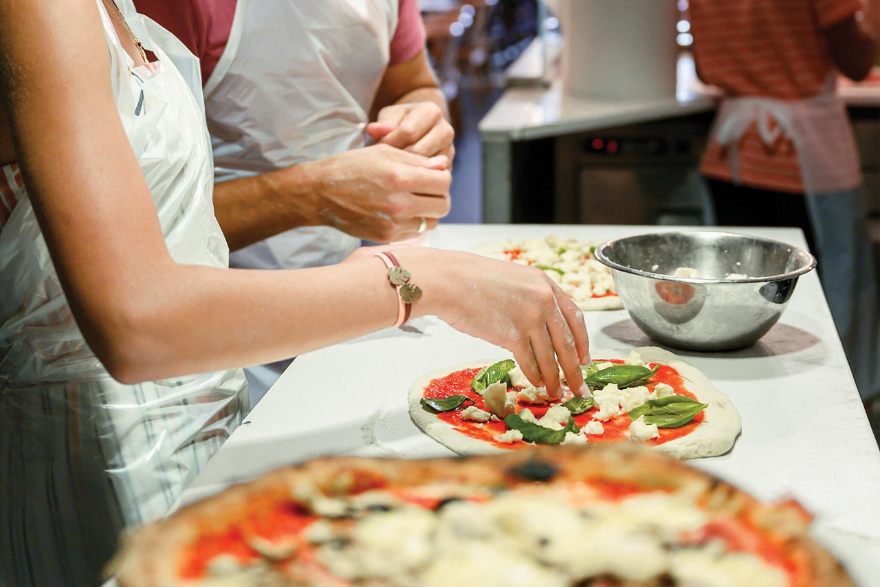 Thin crust homemade tomato sauce pizza making in Italy Rome