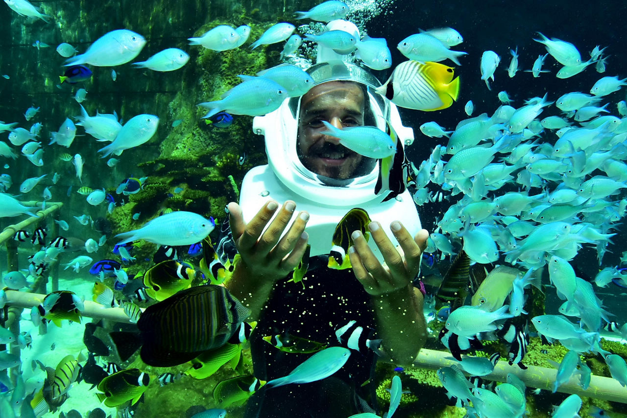 underwater trekking man wearing helmet