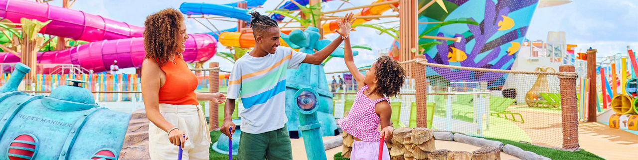 Mother, teenage boy, and daughter having fun at Lost Dunes