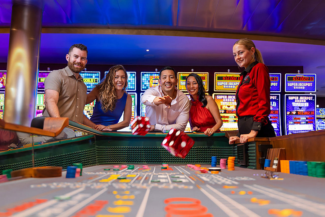 Group of players throwing dice at table in Casino Royale