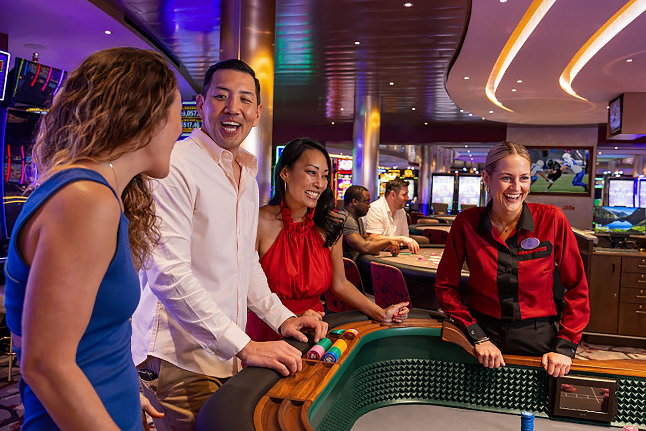 Group of players and attendant at table in Casino Royale