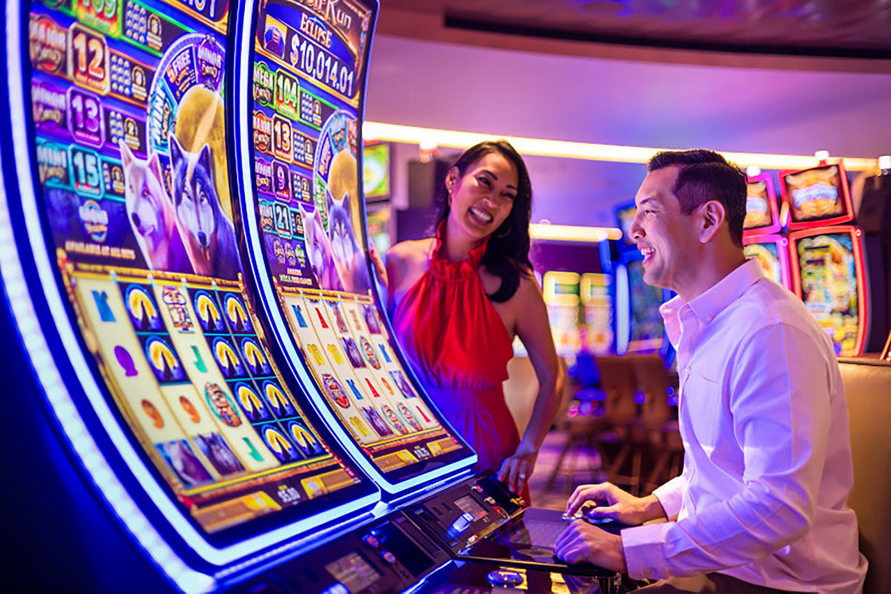 Couple at Casino Royale slot machine