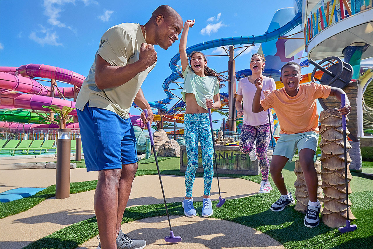 Family Playing Mini Golf at Lost Dunes