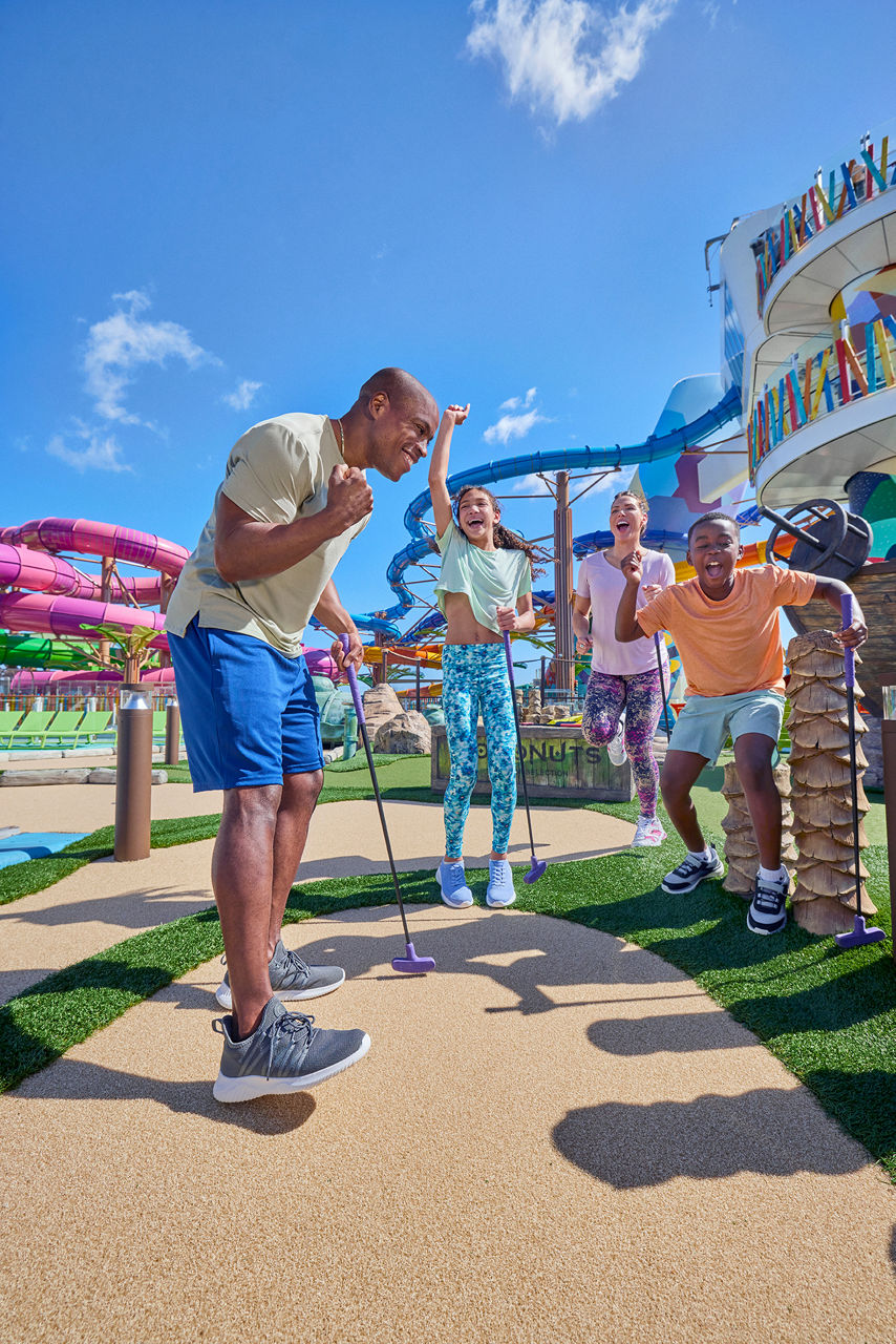 Family Playing Mini Golf at Lost Dunes