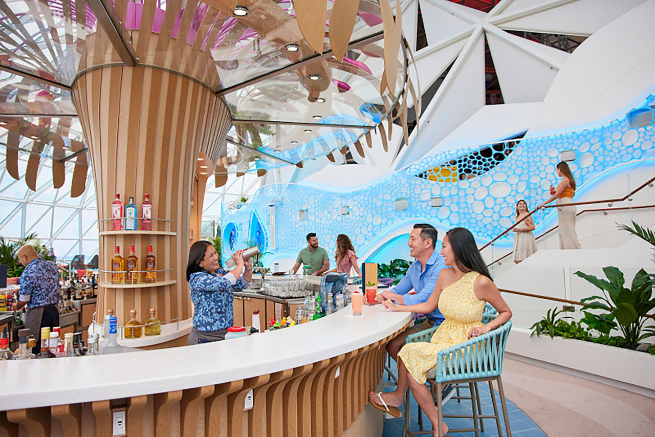 Couples enjoying drinks, cocktails at the Overlook Bar while bartender preparing drinks