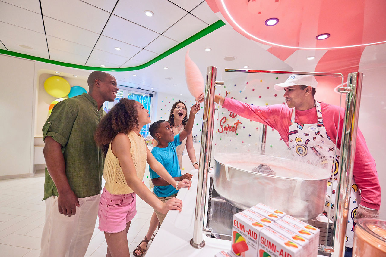 Family Getting Cotton Candy at Sugar Beach