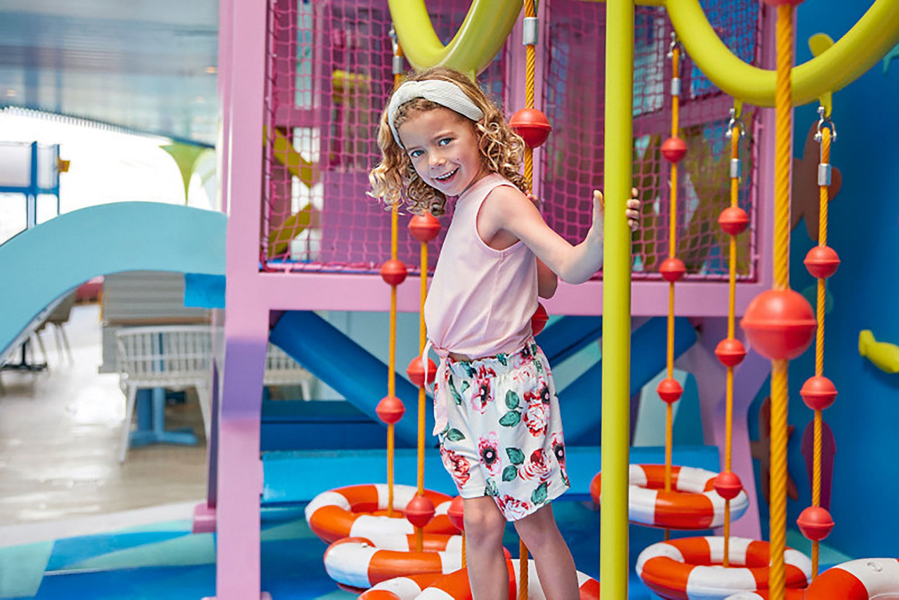 Young girl having fun at Surfside Playscape at Icon of the Seas