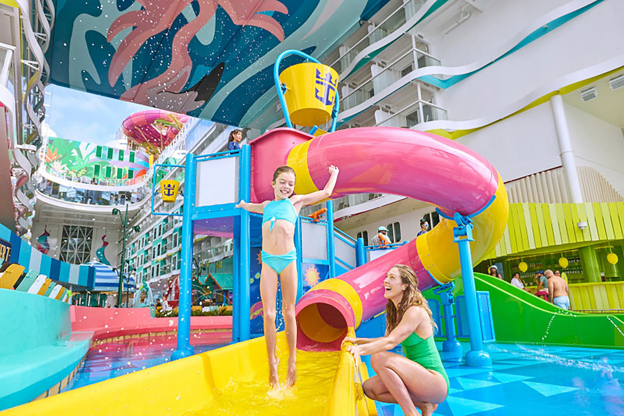 Mom and daughter play on the slide at splashaway bay at surfside