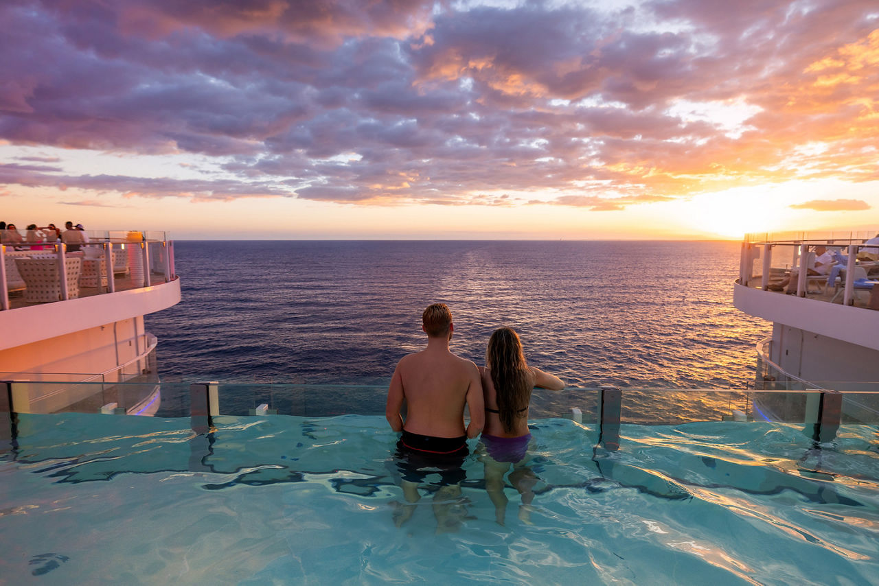 Couple Enjoying the Hideaway Pool during Sunset