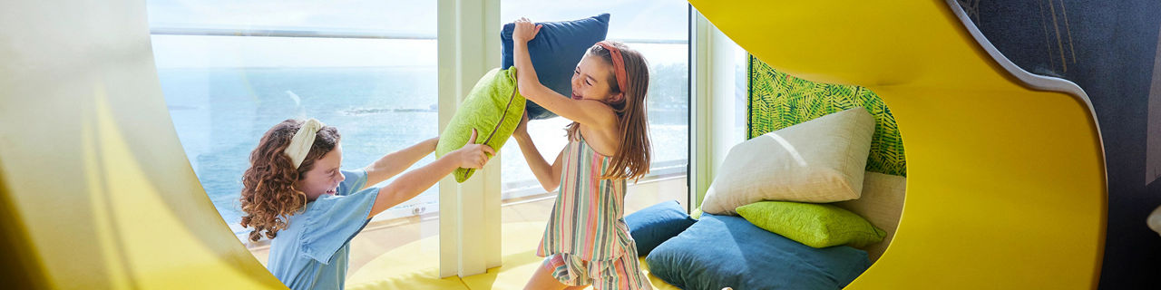 Icon of the Seas kids playing with pillows in Ultimate Family Townhouse