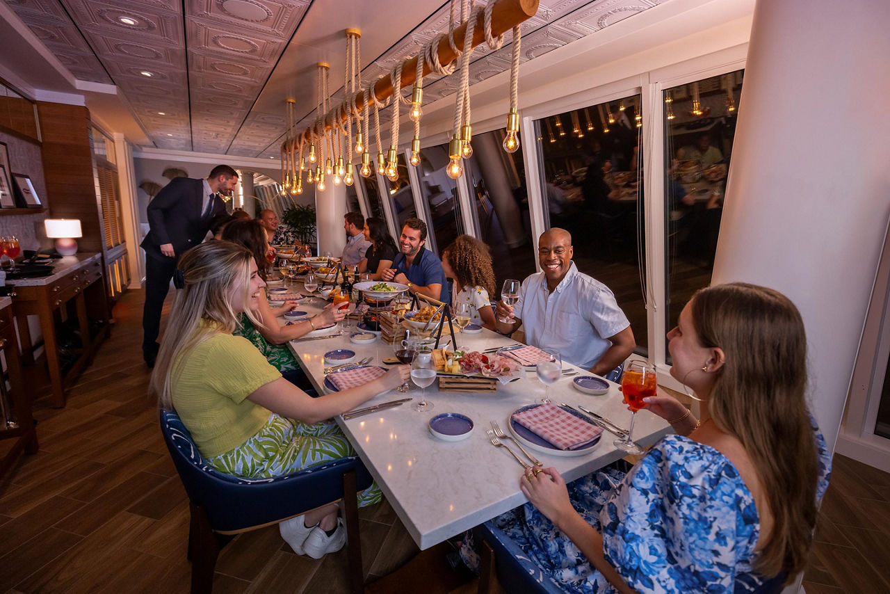 Friends Enjoying Dinner at Celebration Table