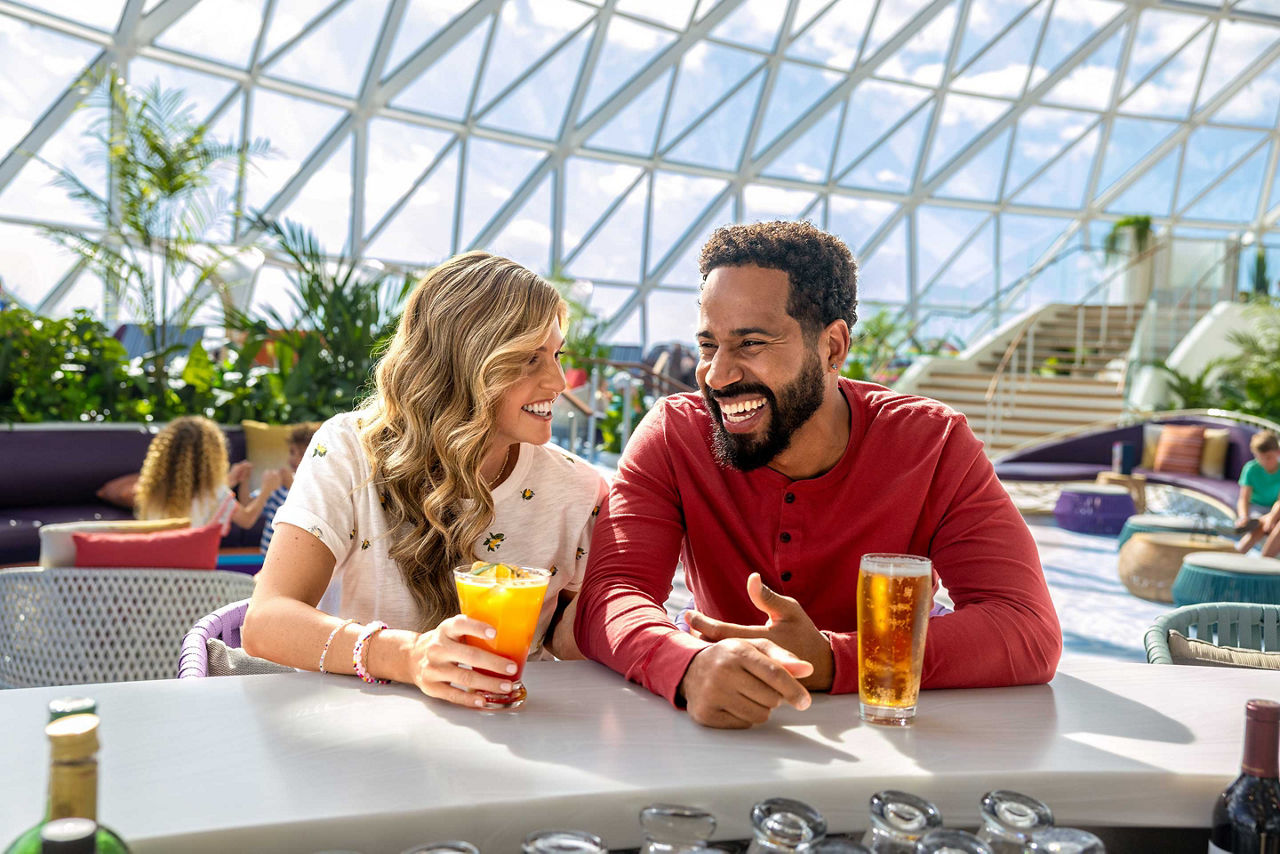 icon of the seas couple having juice drink view at overlook