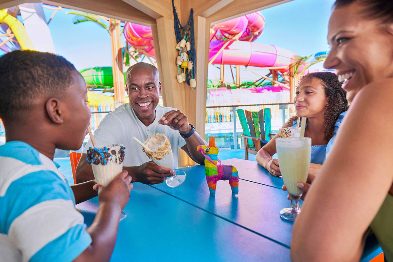 icon of the seas family enjoying their dessert ice cream at basecamp