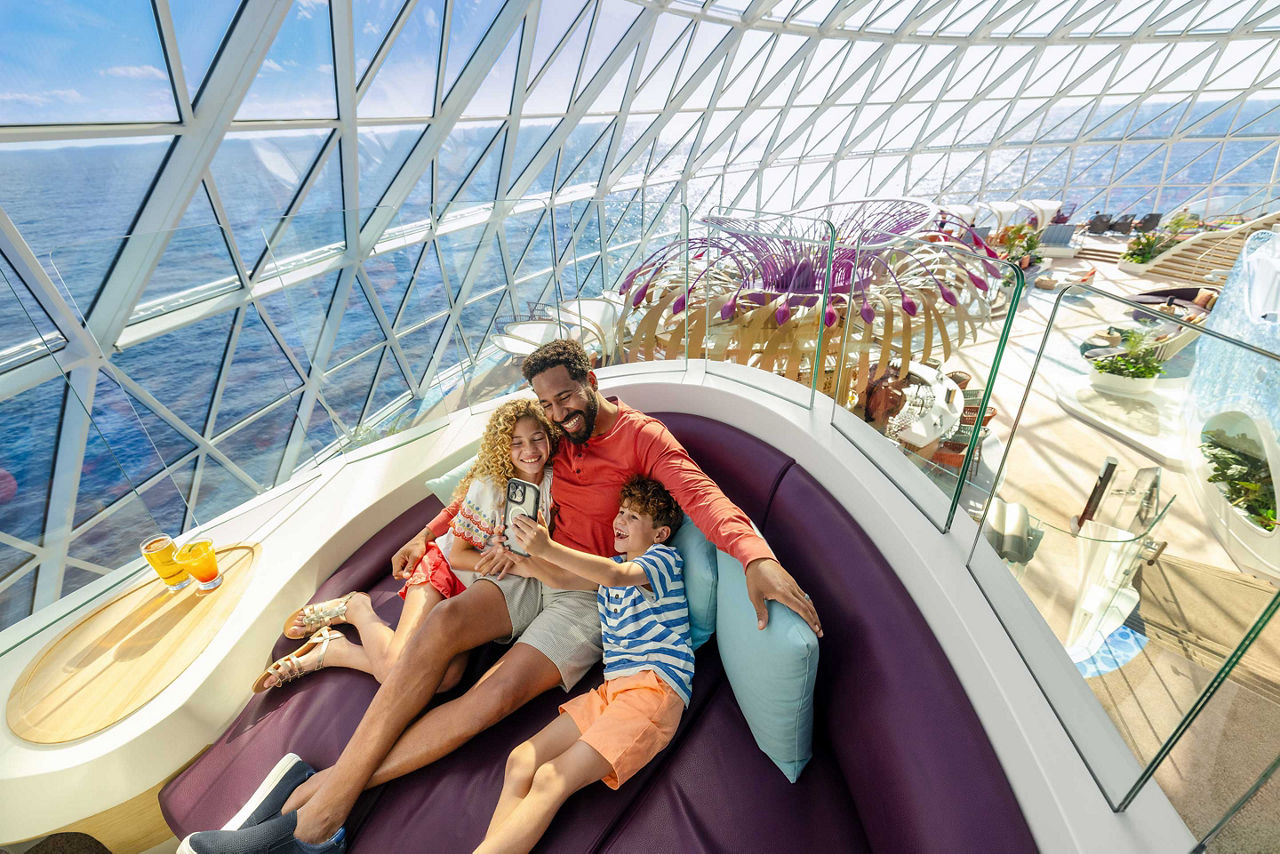 icon of the seas father with kids enjoying clicking snaps at overlook