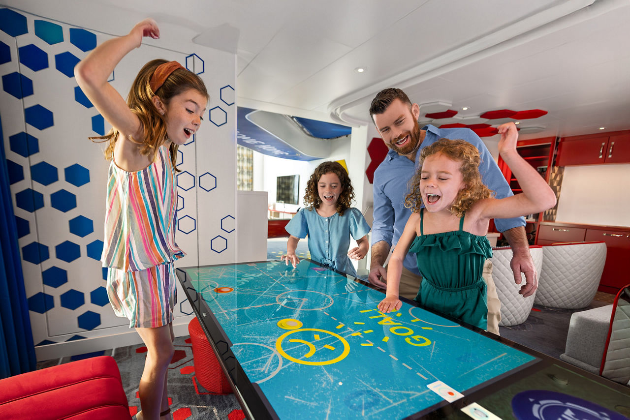 Dad and kids playing games in Ultimate Family Townhouse