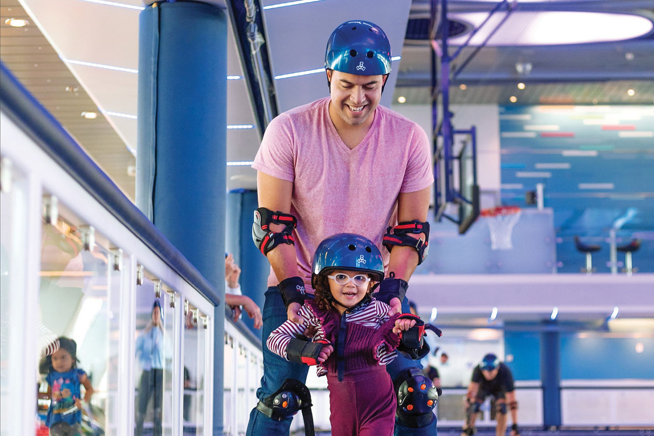 Dad teaching daughter at Seaplex Roller Skating