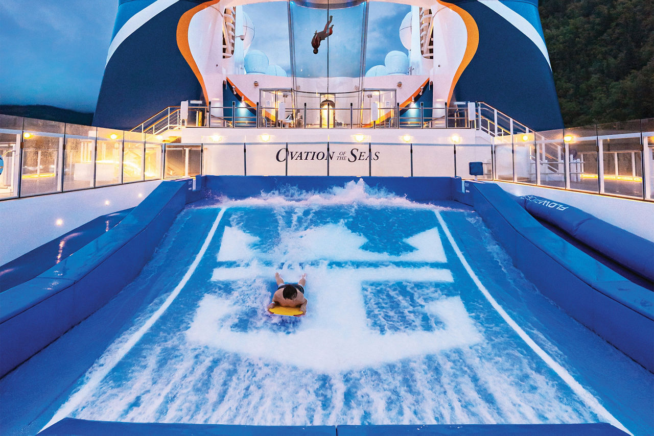 Man lying on board at Flowrider