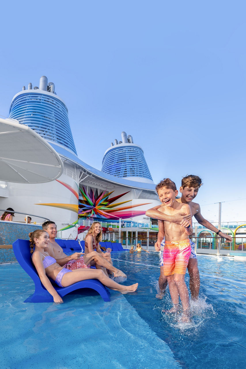 family relaxing brothers splashing royal bay pool star of the seas