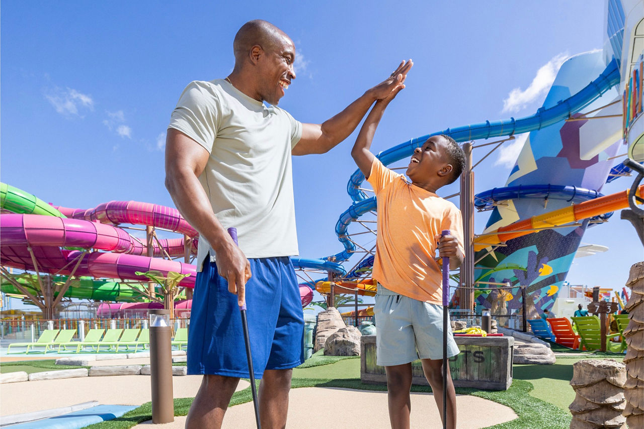 Father and son high five at Lost Dune