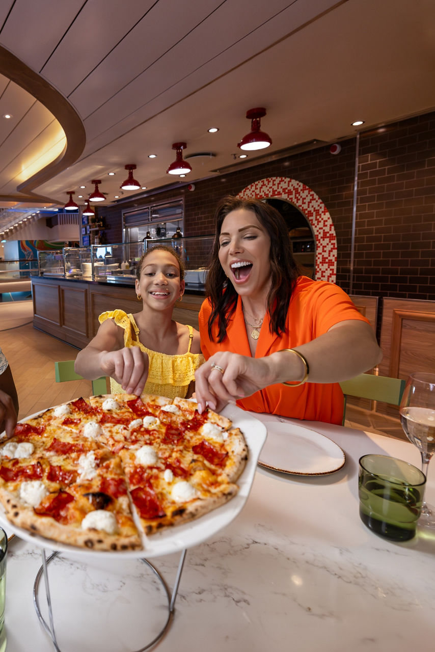 Mother and Daughter sharing pizza at Giovannis Wine Bar