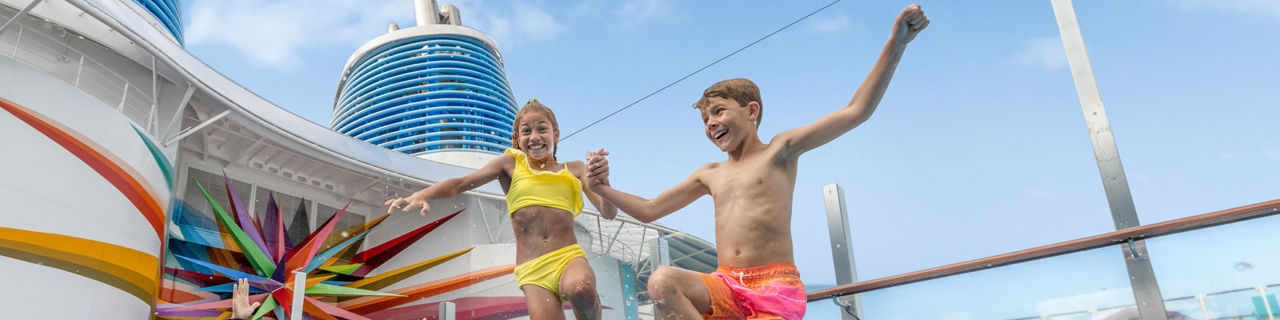 Royal Bay Pool family with kids, jumping on the water