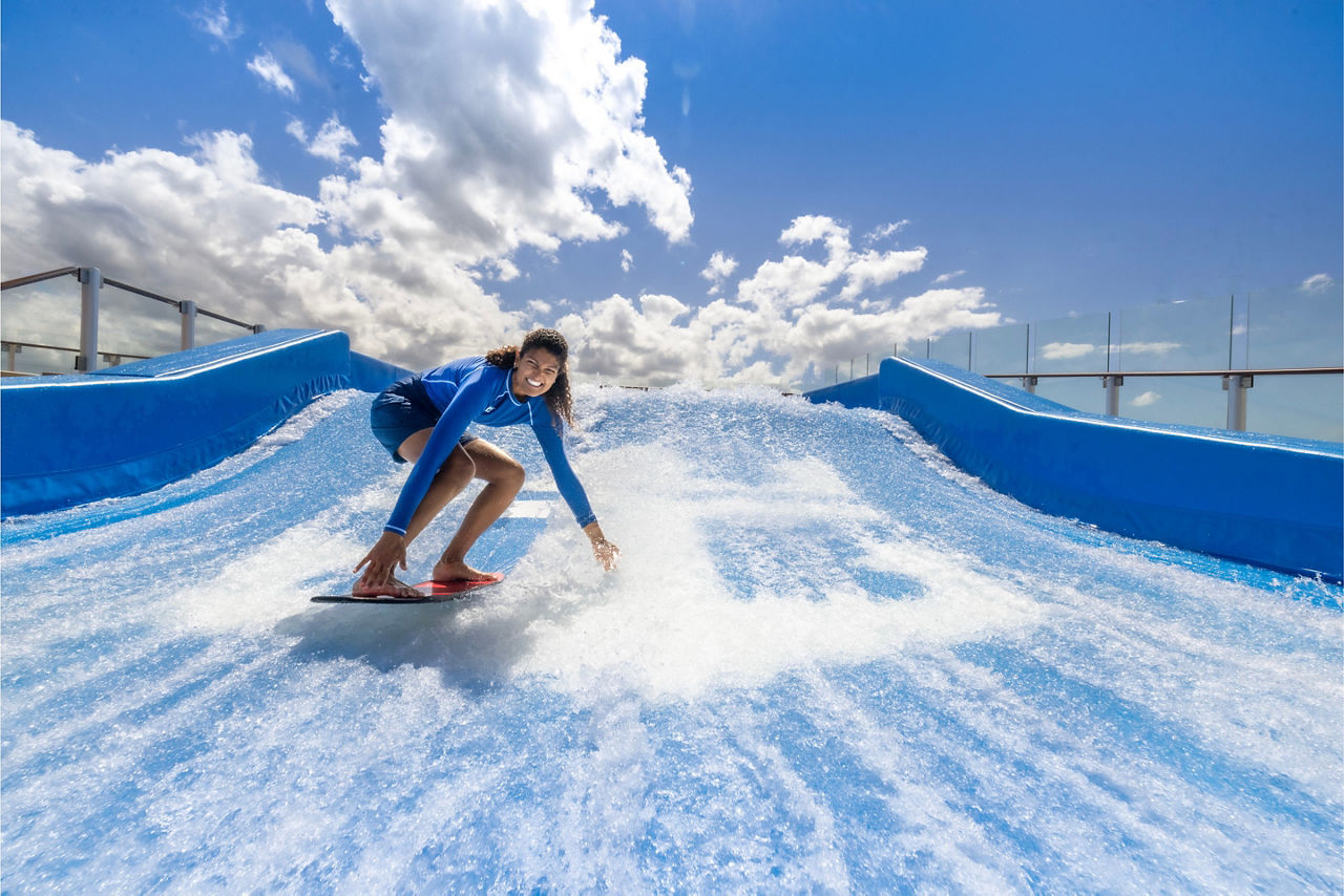 star of the seas woman surfing standing flowrider