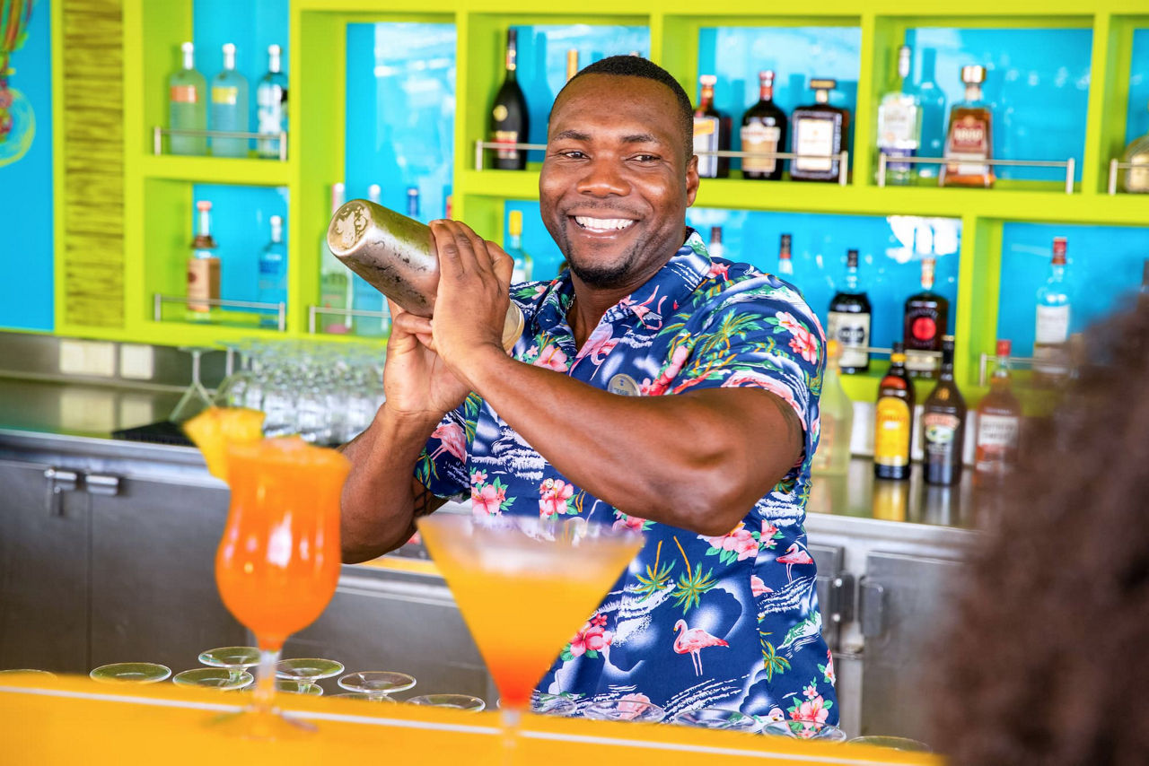Bartender mixing drinks at the Lime Coconut