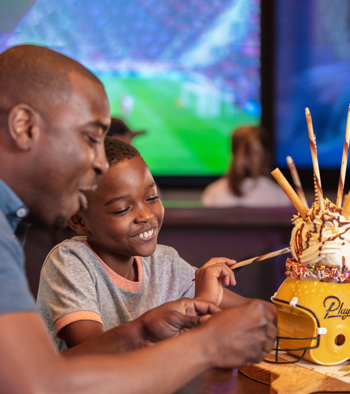 Father and Son Ice Cream Dessert at Playmakers at Symphony of the Seas Royal Caribbean
