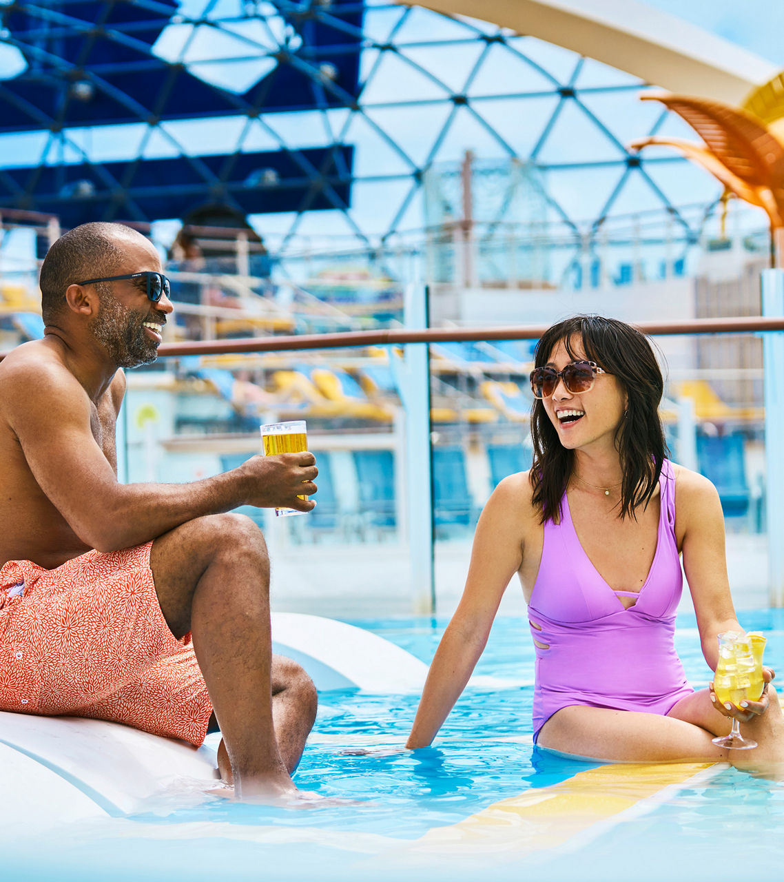 Friends Enjoying Pool deck with Cocktails and Tanning on Wonder of the Seas Royal Caribbean