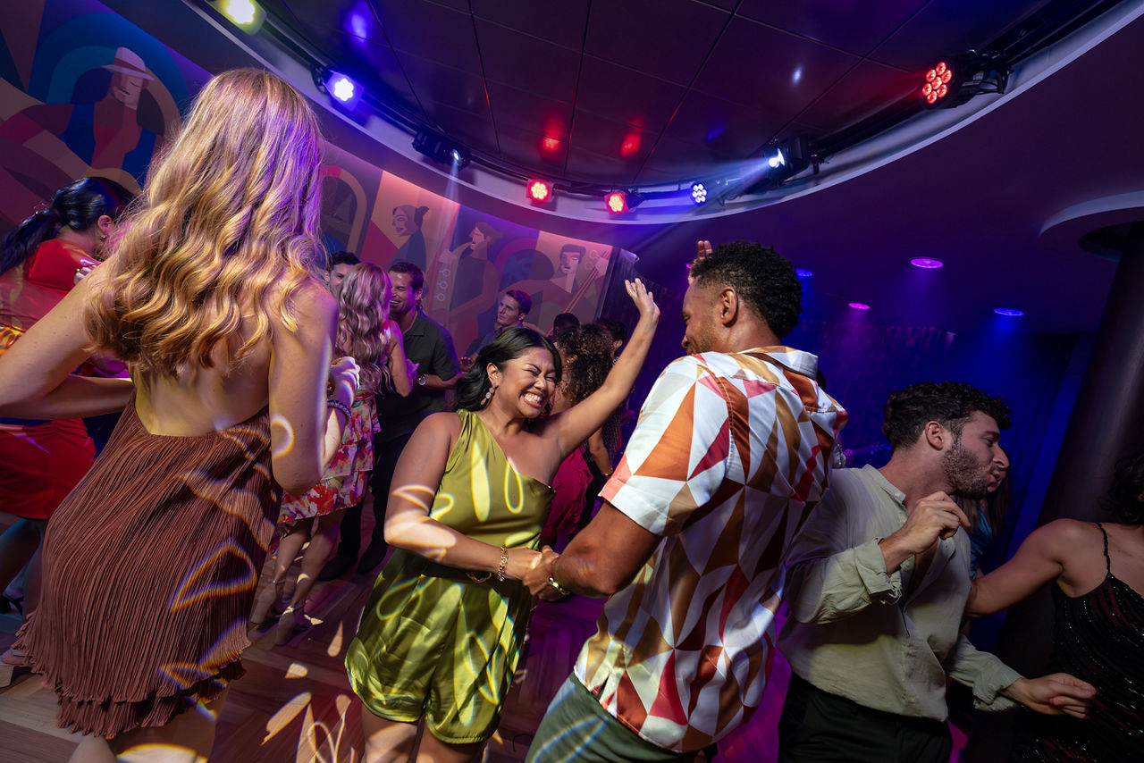 Couple dancing at Boleros onboard Utopia of the Seas