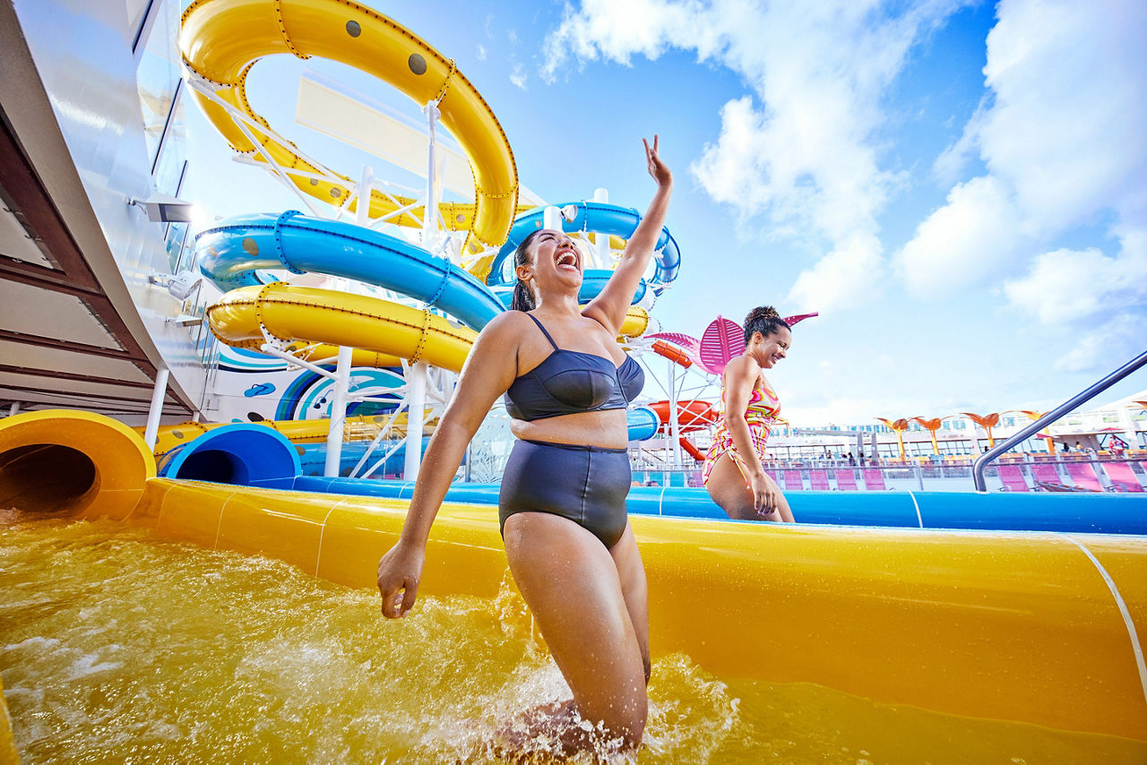 Friends enjoying waterslide onboard Utopia of the Seas, fun, excitement, thrills, Typhoon Cyclone, slide, waterslide,