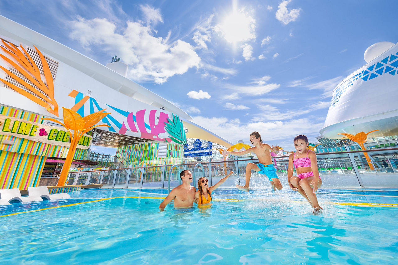 Family splashing, having fun, on the portside pool 