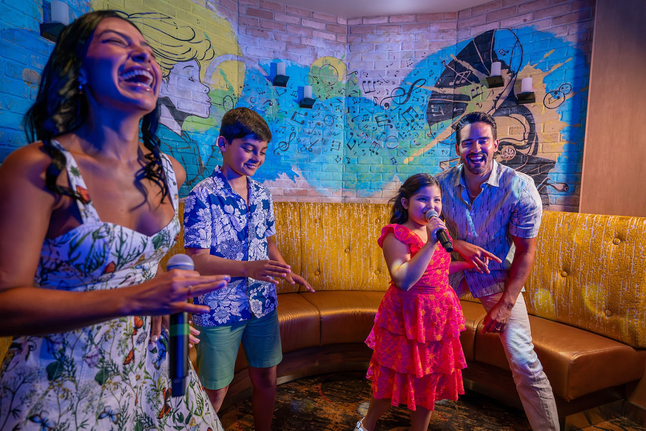 Family singing in private room at Spotlight Karaoke