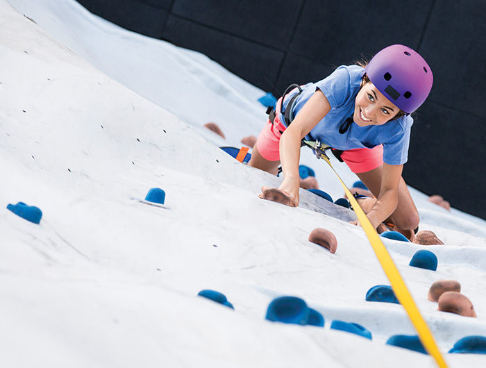 Young Woman Rock Climbing
