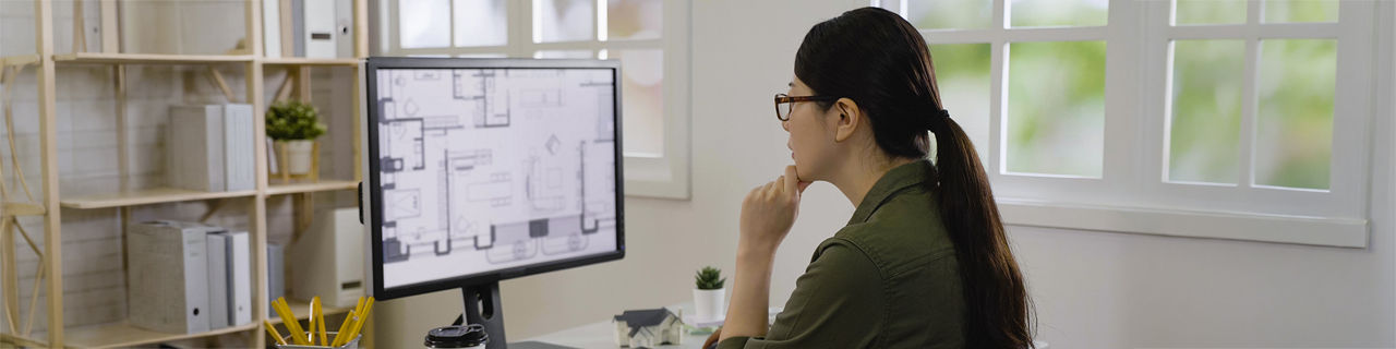 engineer thoughtful staring on computer monitor