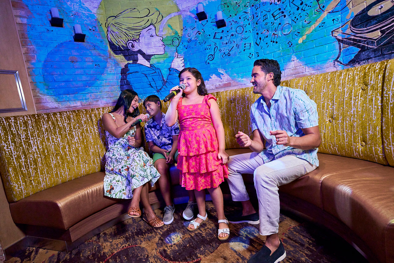 Family singing at Spotlight Karaoke