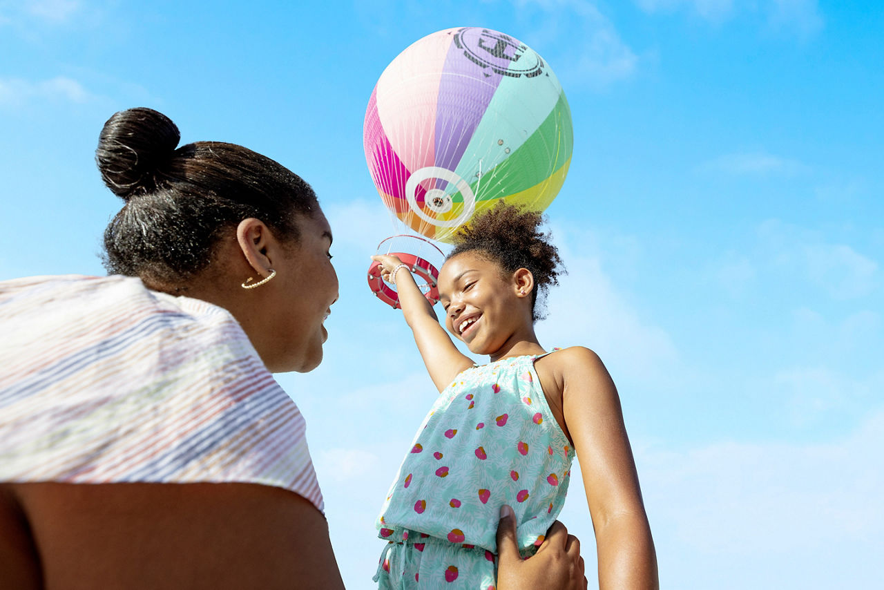 utopia of the seas perfect day girl with mom having fun with balloon in sky