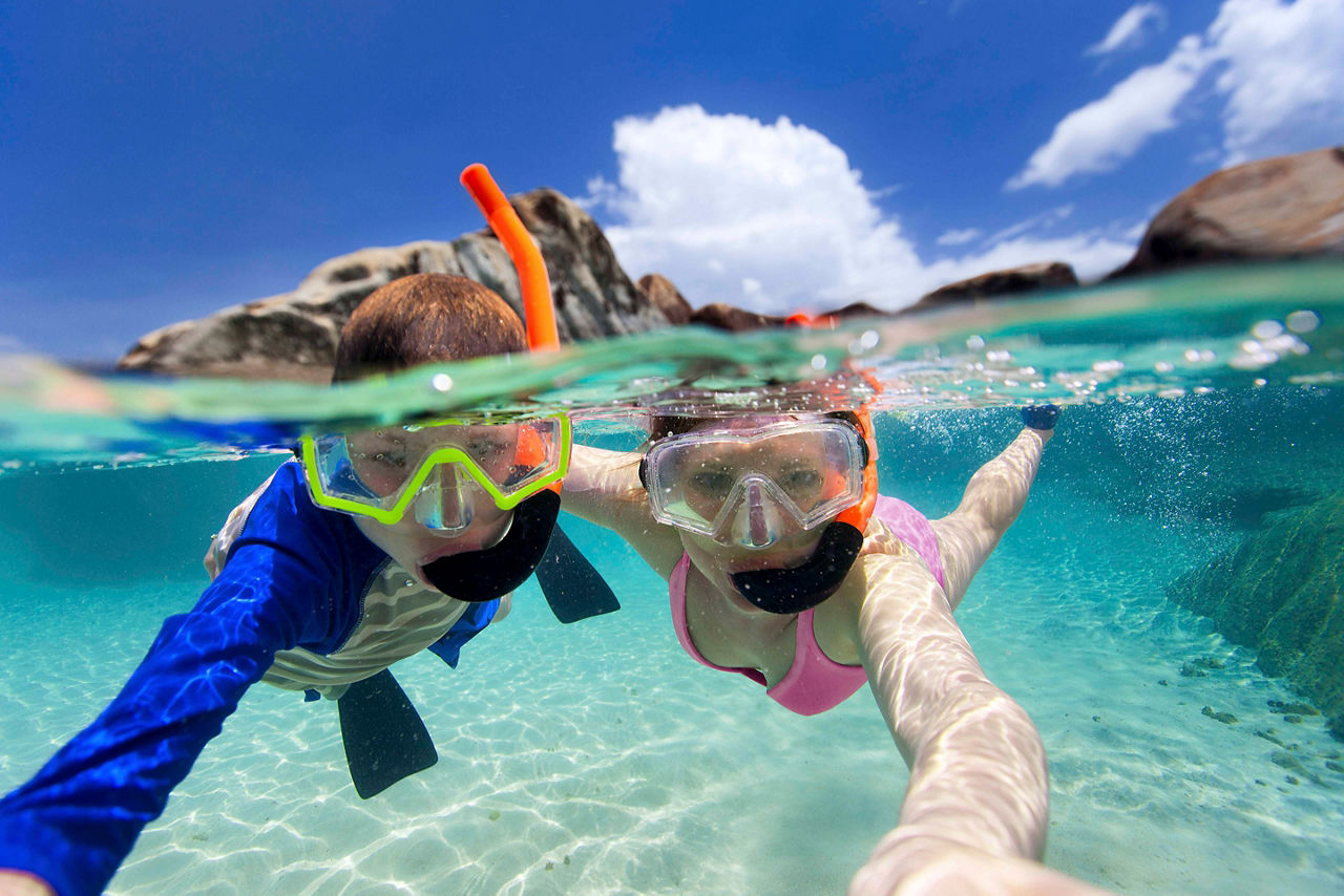 Mother and Son Snorkeling and Taking a Selfie