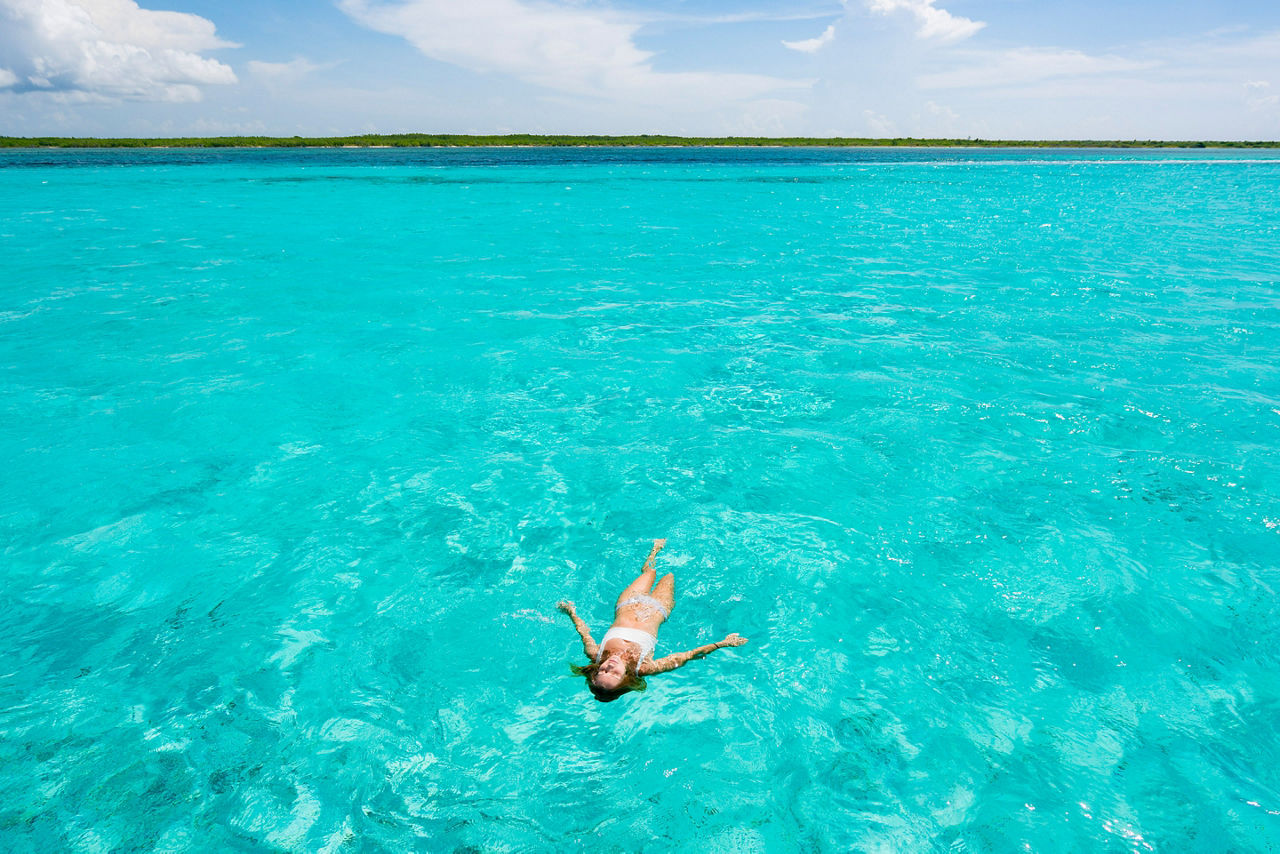 Woman Floating in Caribbean Waters