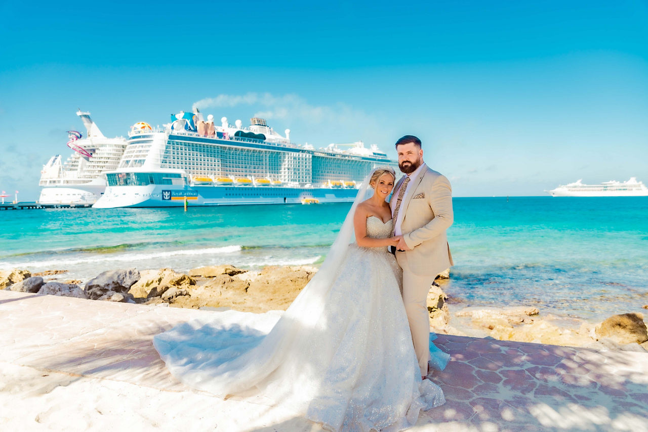 husband and wife with royal caribbean ships in the bahamas wedding loverly giftcard promo