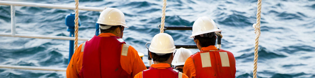 Ship crew wearing life vest 